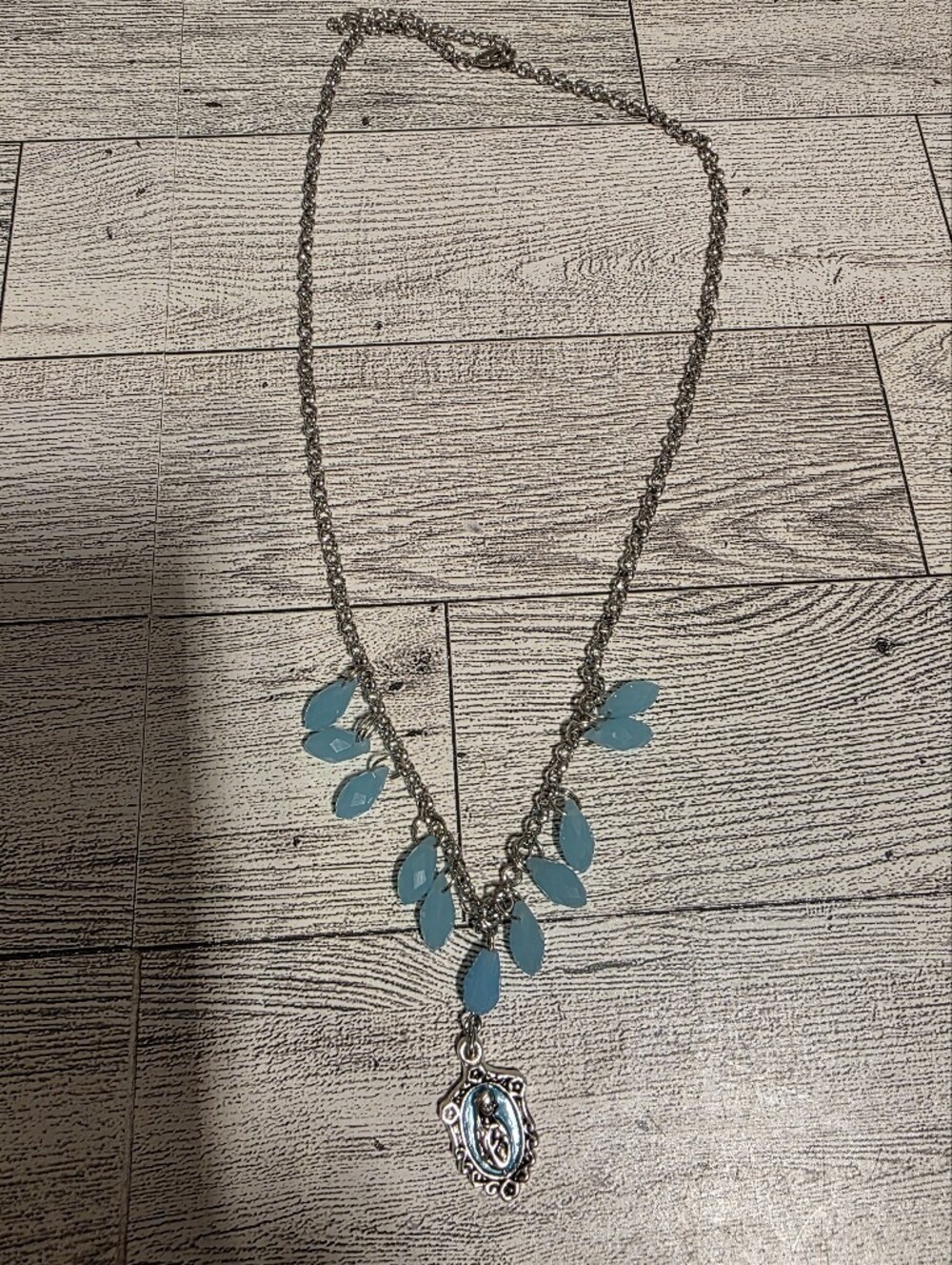 Silver-Tone Necklace with Teal Leaf Accents and Pendant